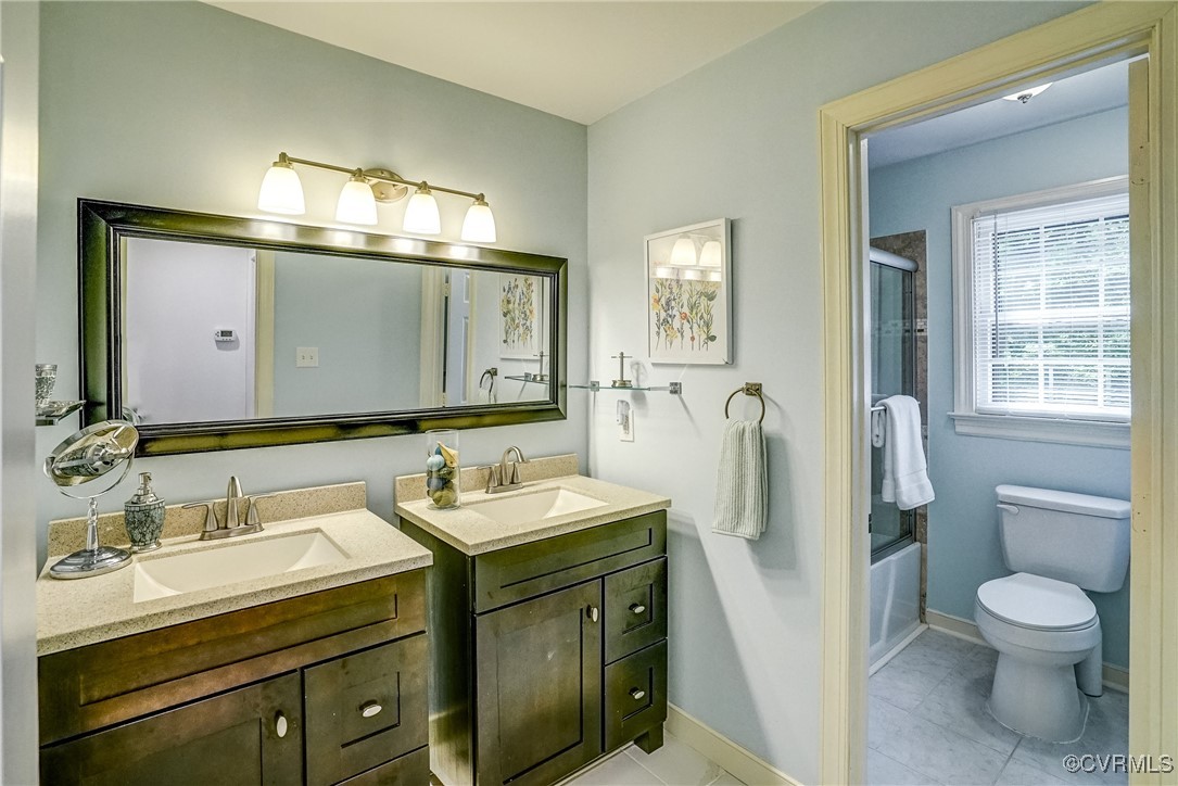 3630 Lansdowne Road Midlothian, VA 23113 - Photo 39 of 50 a bathroom with a toilet sink and mirror