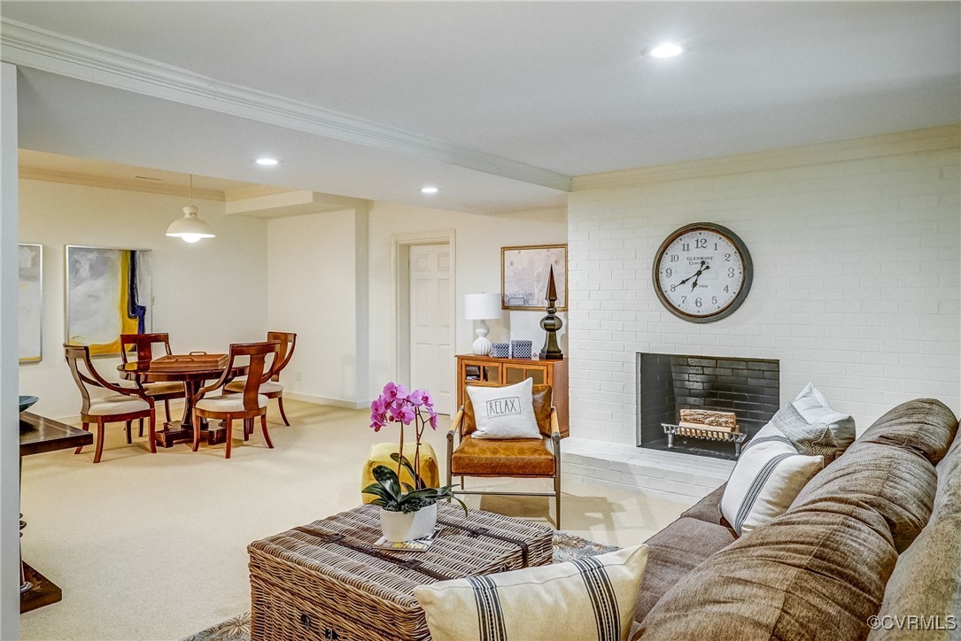 3630 Lansdowne Road Midlothian, VA 23113 - Photo 44 of 50 a living room with furniture a clock and a fireplace