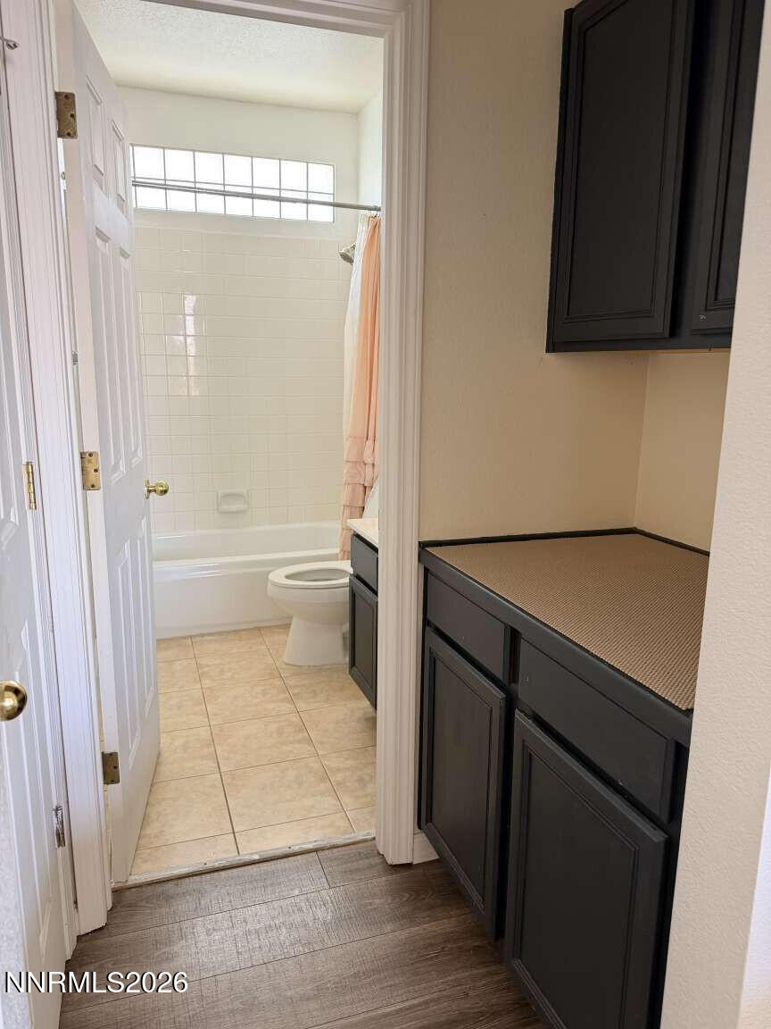 4695 Hampton Lane Reno, NV 89519 - Photo 13 of 20 a bathroom with a tub and a shower