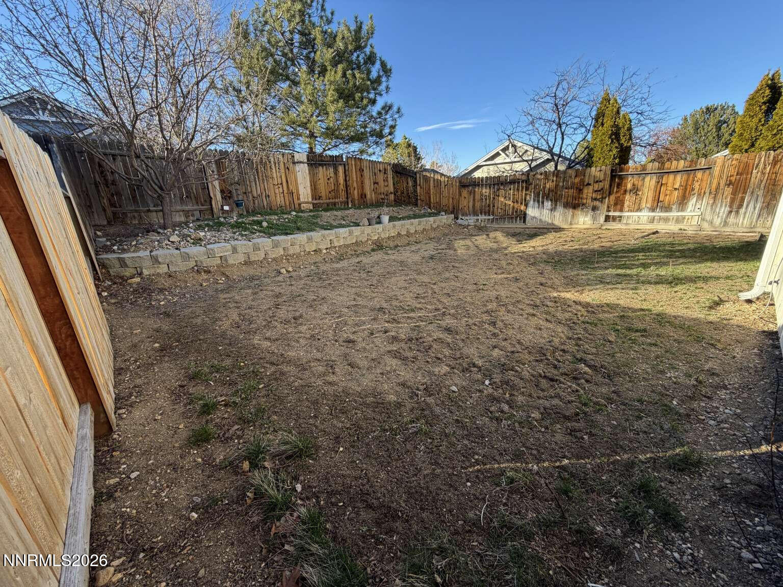 4695 Hampton Lane Reno, NV 89519 - Photo 17 of 20 a view of a yard with wooden fence