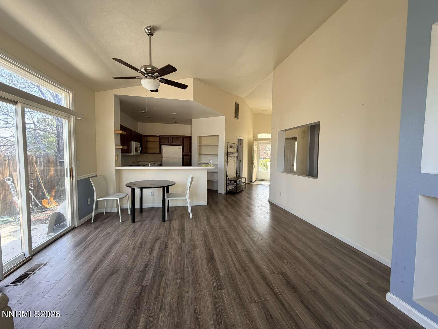 4695 Hampton Lane Reno, NV 89519 - Photo 4 of 20 a view of a livingroom with furniture window and wooden floor