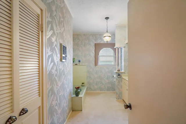 a bathroom with a granite countertop shower