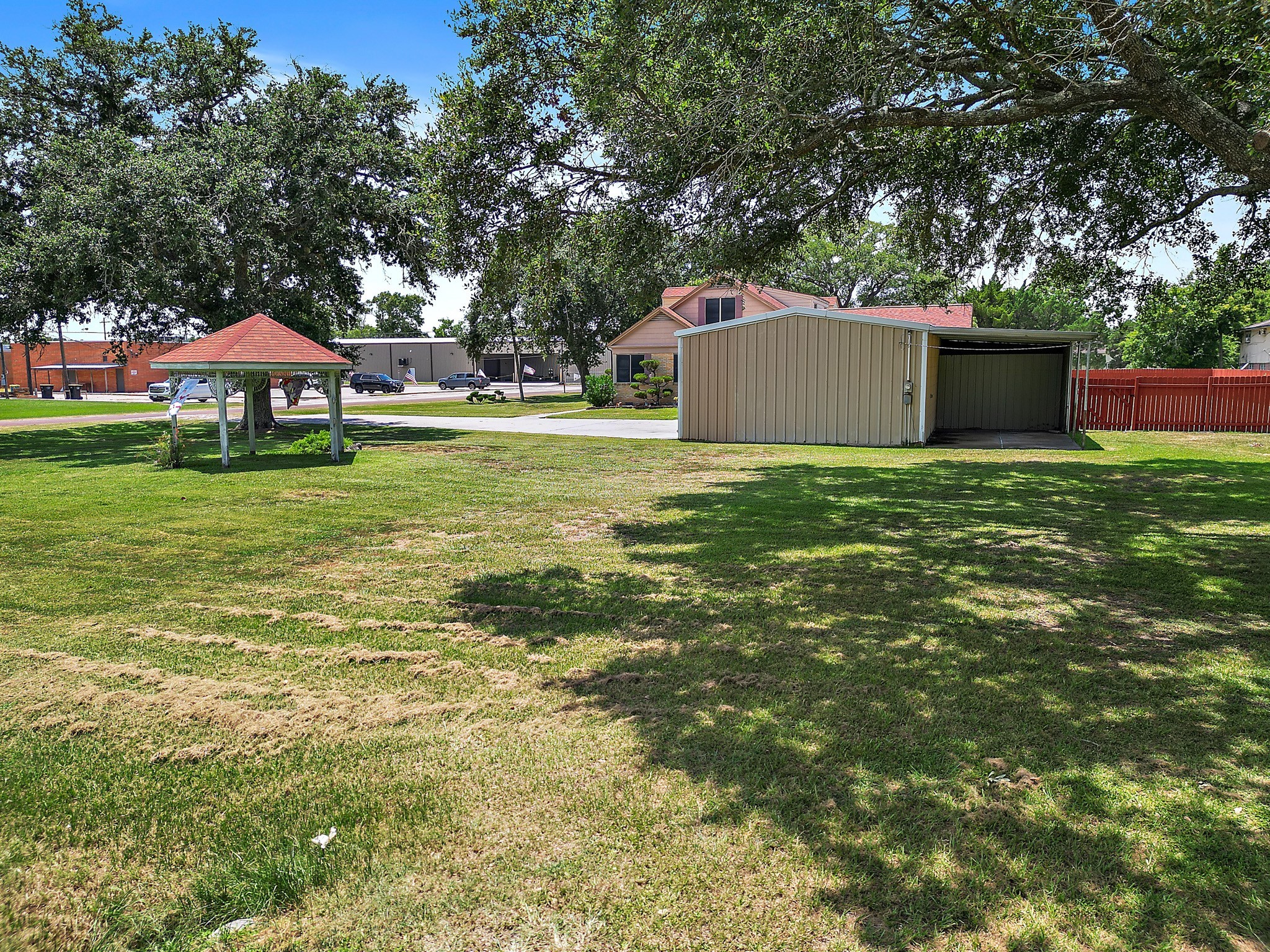 405 Park Street Anahuac, TX 77514 - Photo 3 of 37 a front view of house with yard and trees