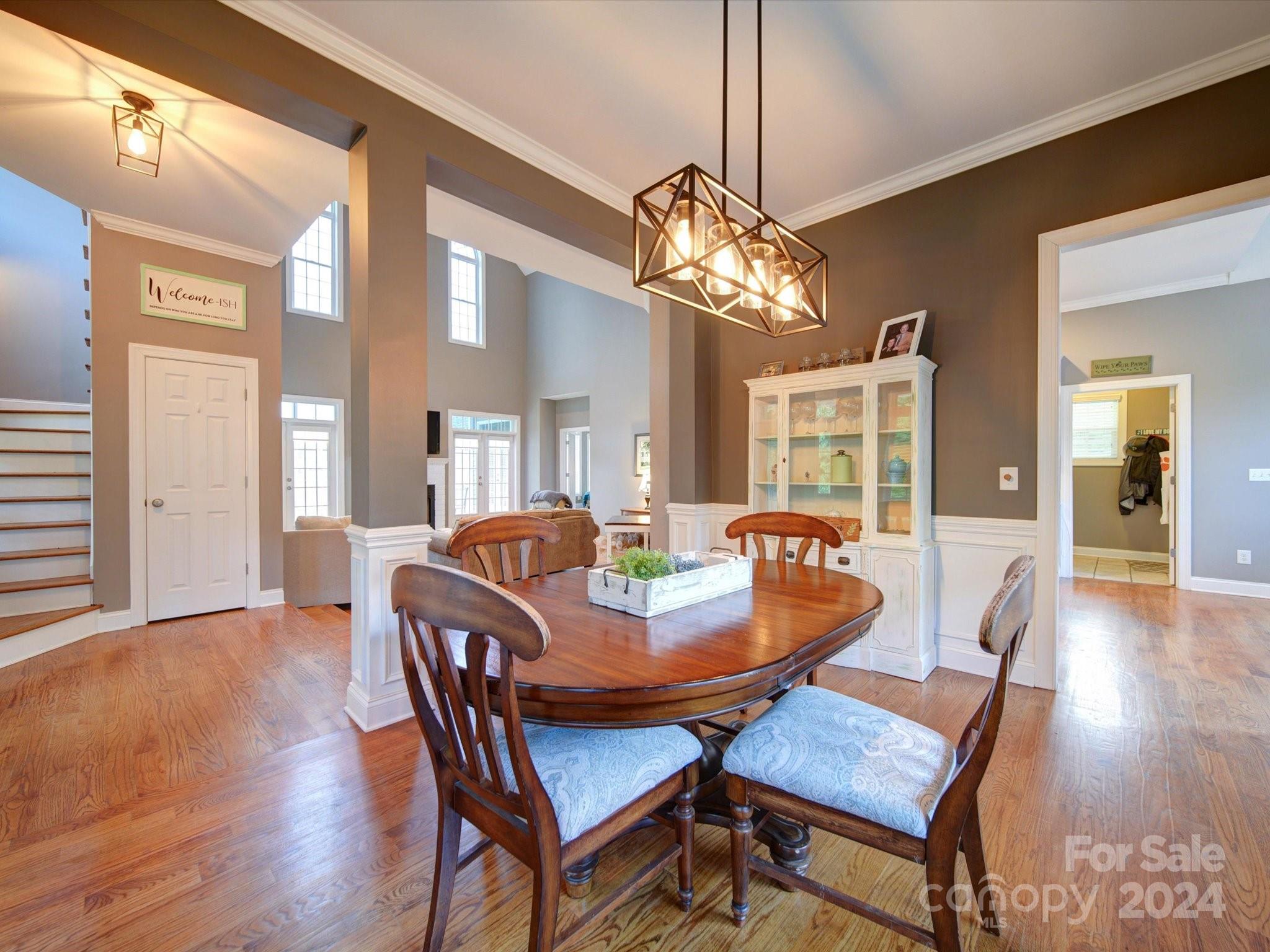 174 Endsgate Road, Unit B Clover, SC 29710 - Photo 17 of 39 a dining room with furniture a chandelier and wooden floor
