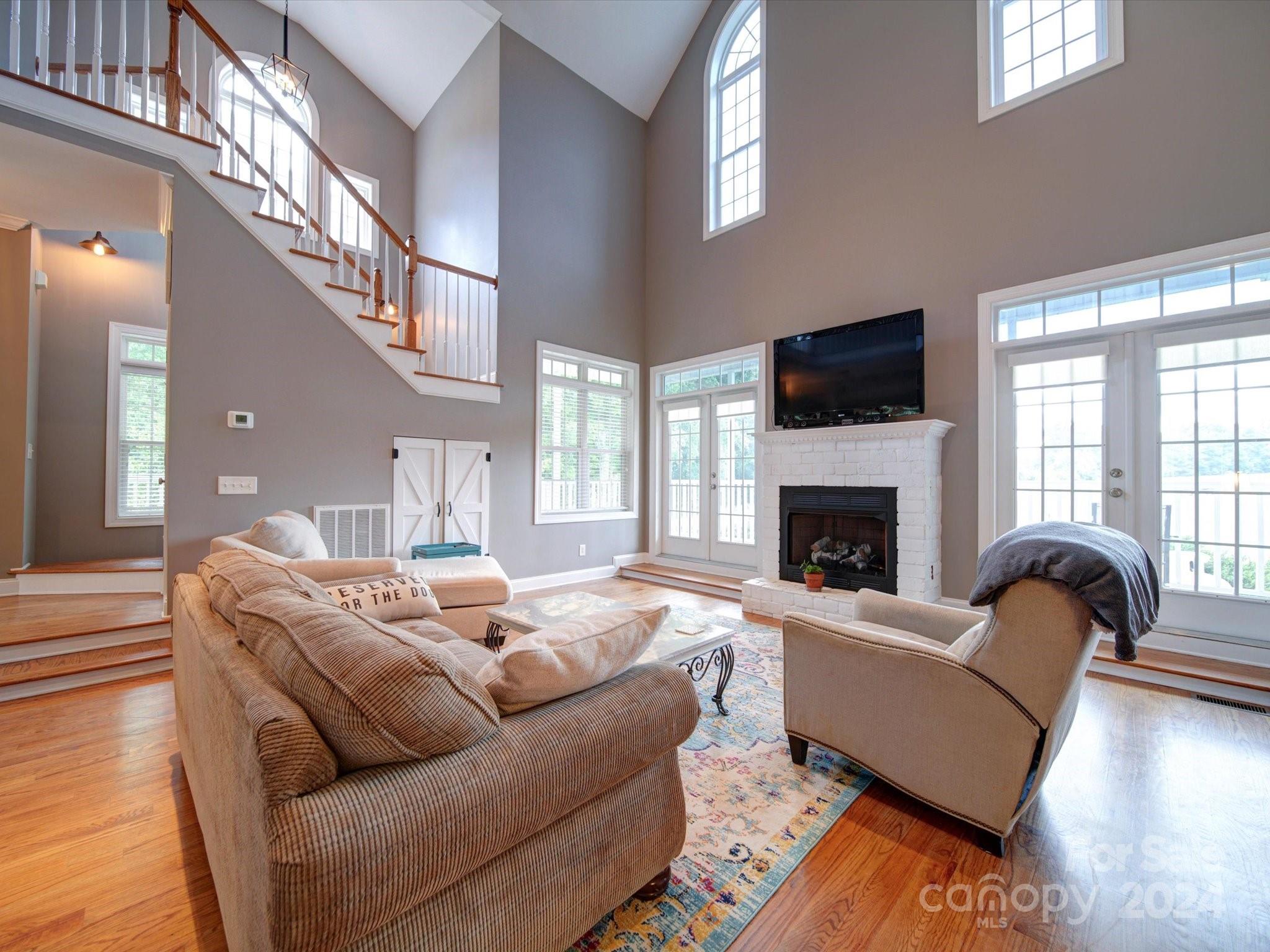 174 Endsgate Road, Unit B Clover, SC 29710 - Photo 8 of 39 a living room with furniture fireplace and a flat screen tv