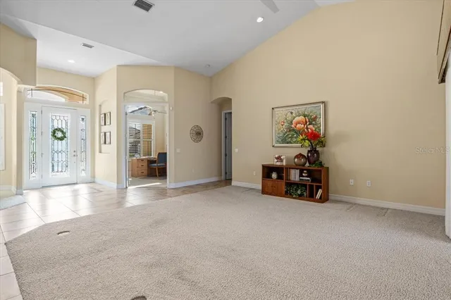 a dining room with stainless steel appliances kitchen island granite countertop a stove a kitchen island a dining table and chairs