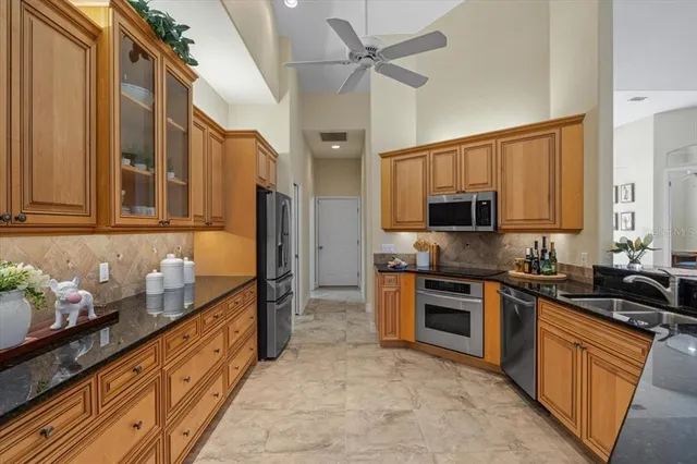 a bedroom with furniture and large windows
