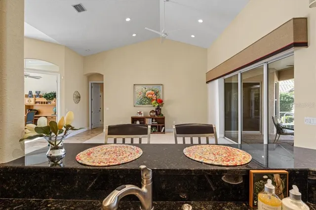 a spacious bedroom with a bed and a potted plant