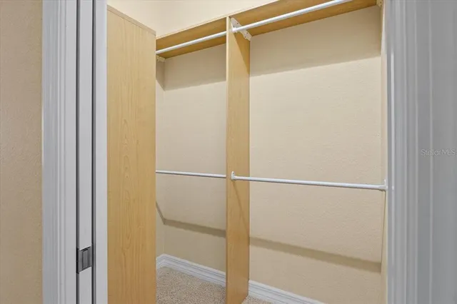 a view of a swimming pool with outdoor seating and a yard