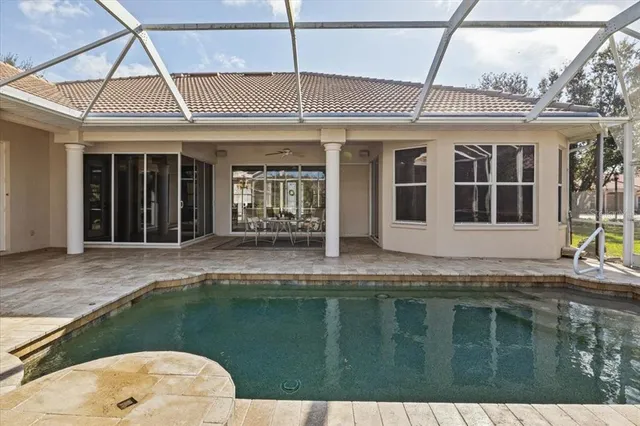 a view of a lake with houses in the back