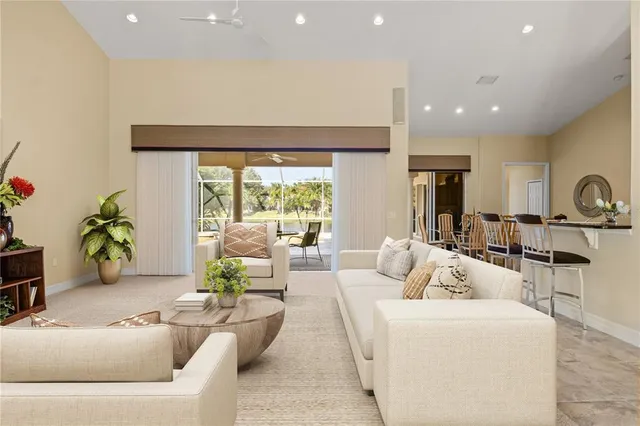 a view of a livingroom with furniture and a flat screen tv