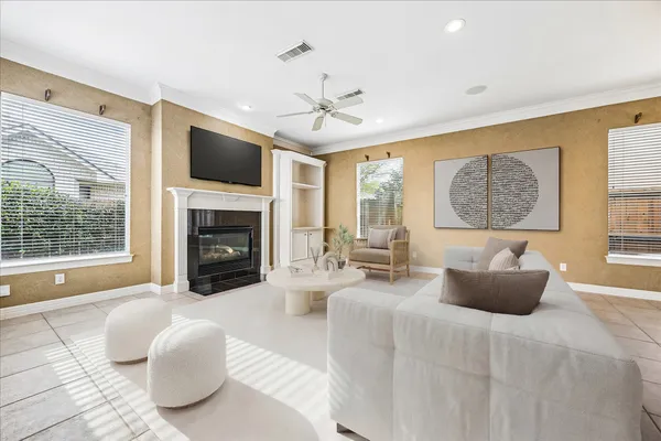 a view of an empty room with a fireplace and a window