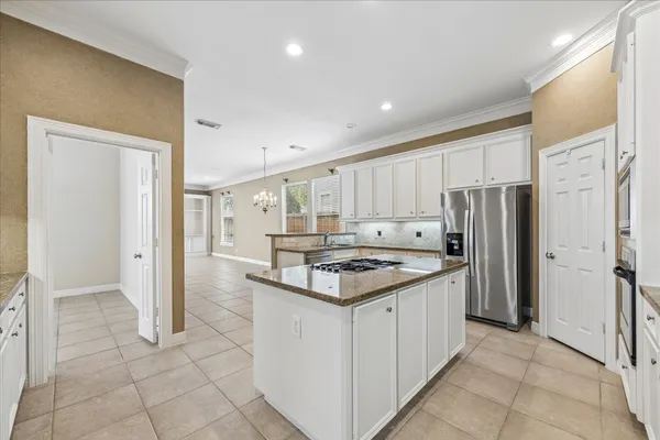 a view of a kitchen with a sink and cabinets