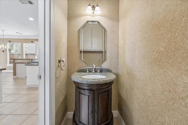 a kitchen with granite countertop white cabinets white stainless steel appliances with a sink and dishwasher