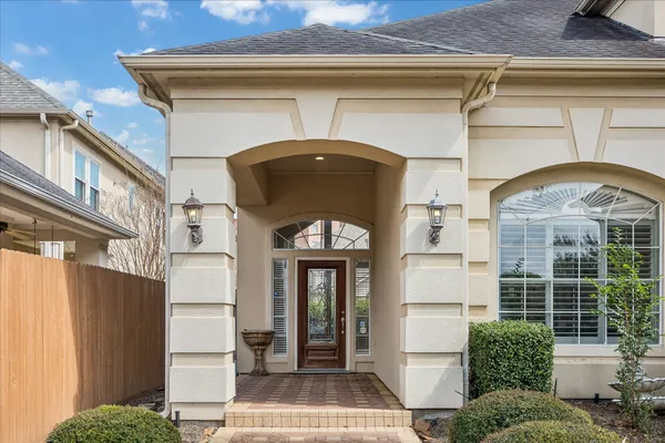 a front view of a house with large windows