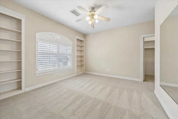 a living room with furniture and flowers