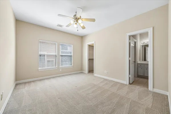 a bedroom with a bed furniture and a book shelf