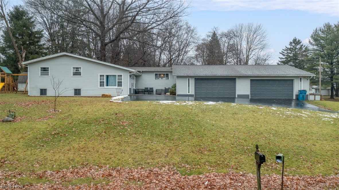 1165 Meadowview Road Kent, OH 44240 - Photo 2 of 40 tri-level style house with a garage and a front lawn