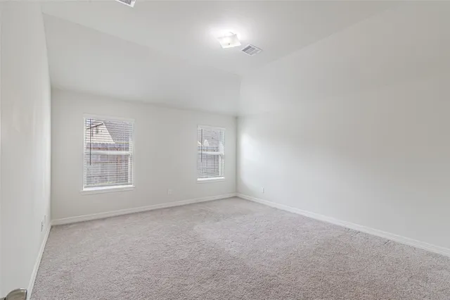 a aerial view of a house with a yard