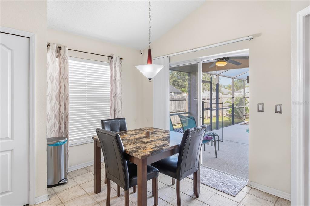 13107 Heming Way Orlando, FL 32825 - Photo 11 of 23 a view of a dining room with furniture window and wooden floor