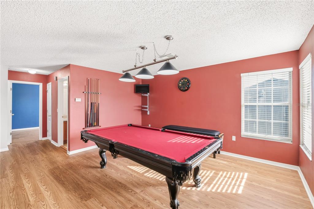 13107 Heming Way Orlando, FL 32825 - Photo 15 of 23 a room with pool table and windows