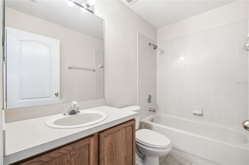 13107 Heming Way Orlando, FL 32825 - Photo 17 of 23 a bathroom with a sink toilet tub and shower