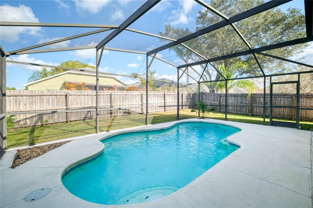 13107 Heming Way Orlando, FL 32825 - Photo 21 of 23 a view of swimming pool with a yard