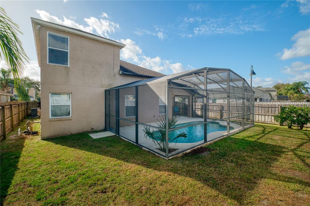 13107 Heming Way Orlando, FL 32825 - Photo 23 of 23 a view of a house with a yard