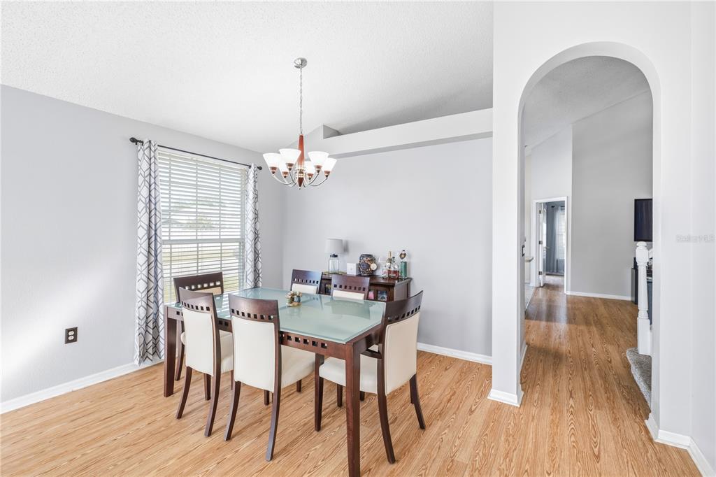 13107 Heming Way Orlando, FL 32825 - Photo 4 of 23 a view of a dining room with furniture window and wooden floor