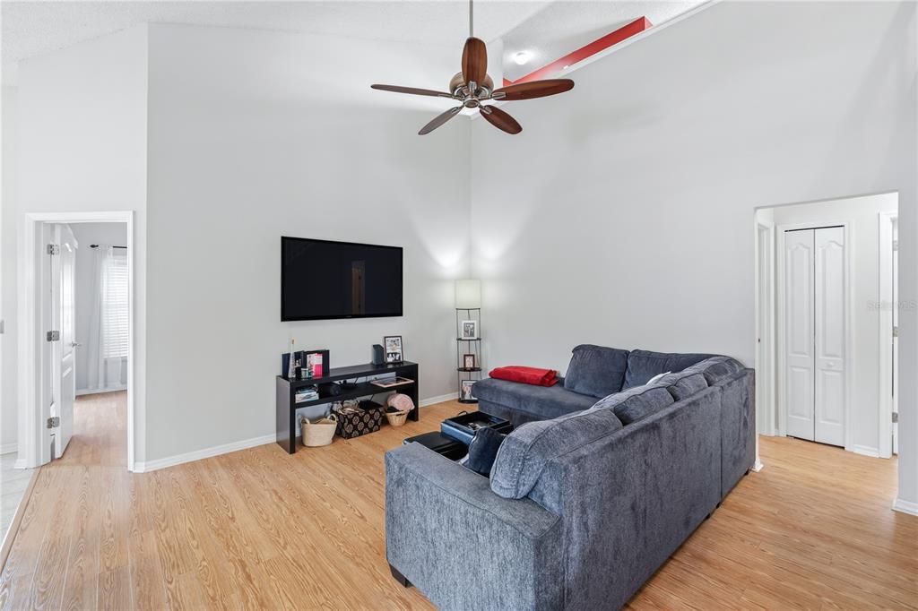 13107 Heming Way Orlando, FL 32825 - Photo 6 of 23 a living room with furniture and a flat screen tv
