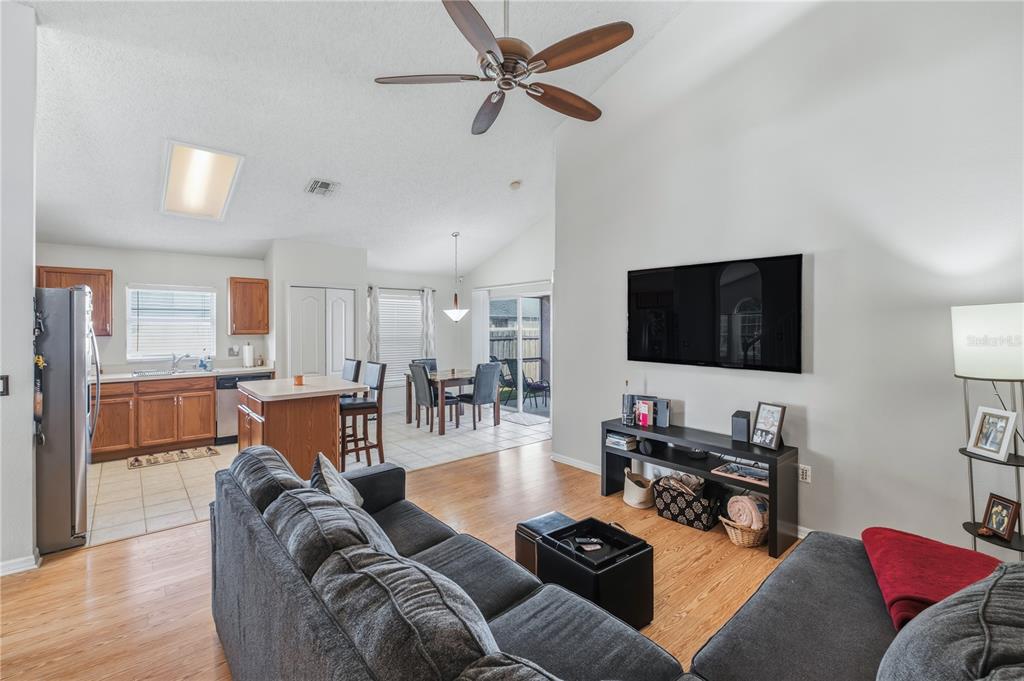 13107 Heming Way Orlando, FL 32825 - Photo 7 of 23 a living room with furniture and a flat screen tv