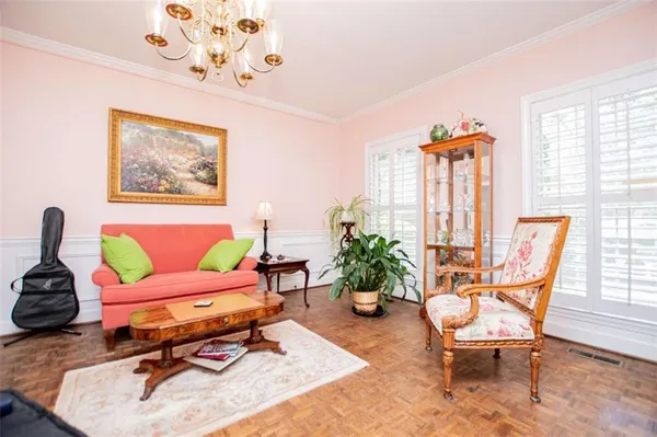 a living room with a fireplace furniture and a window