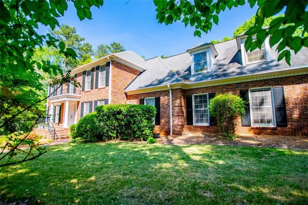 a front view of a house with swimming pool