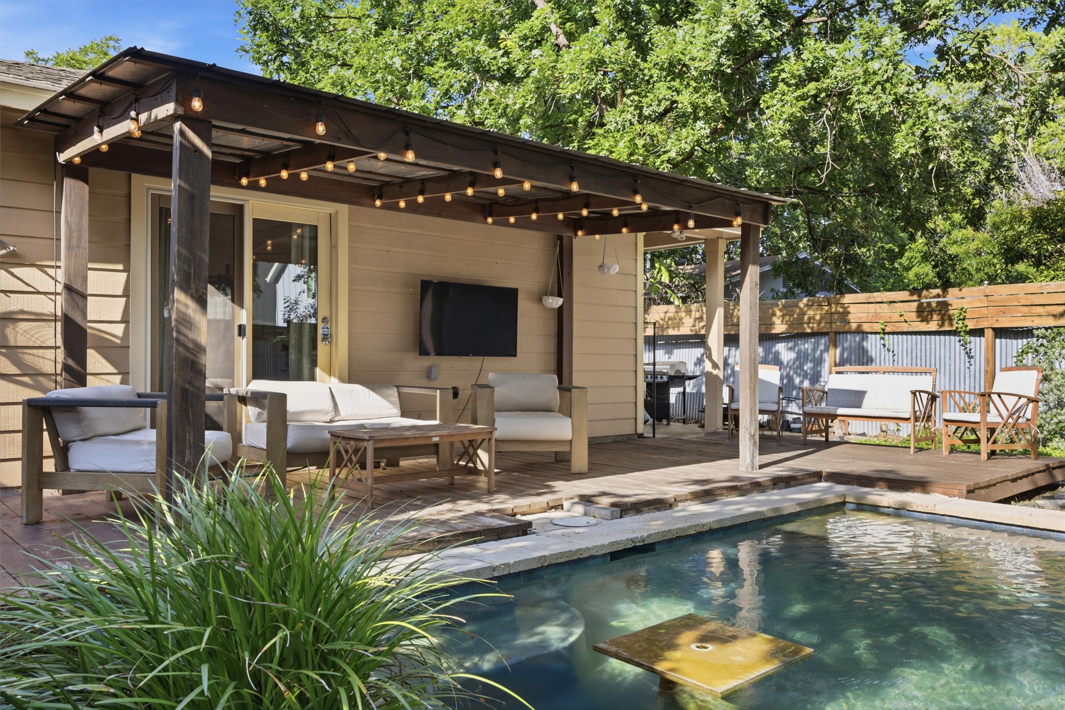 3015 Castro Street Austin, TX 78702 - Photo 34 of 40 A tranquil outdoor haven features a private pool with a spacious deck, perfect for relaxation and entertainment.