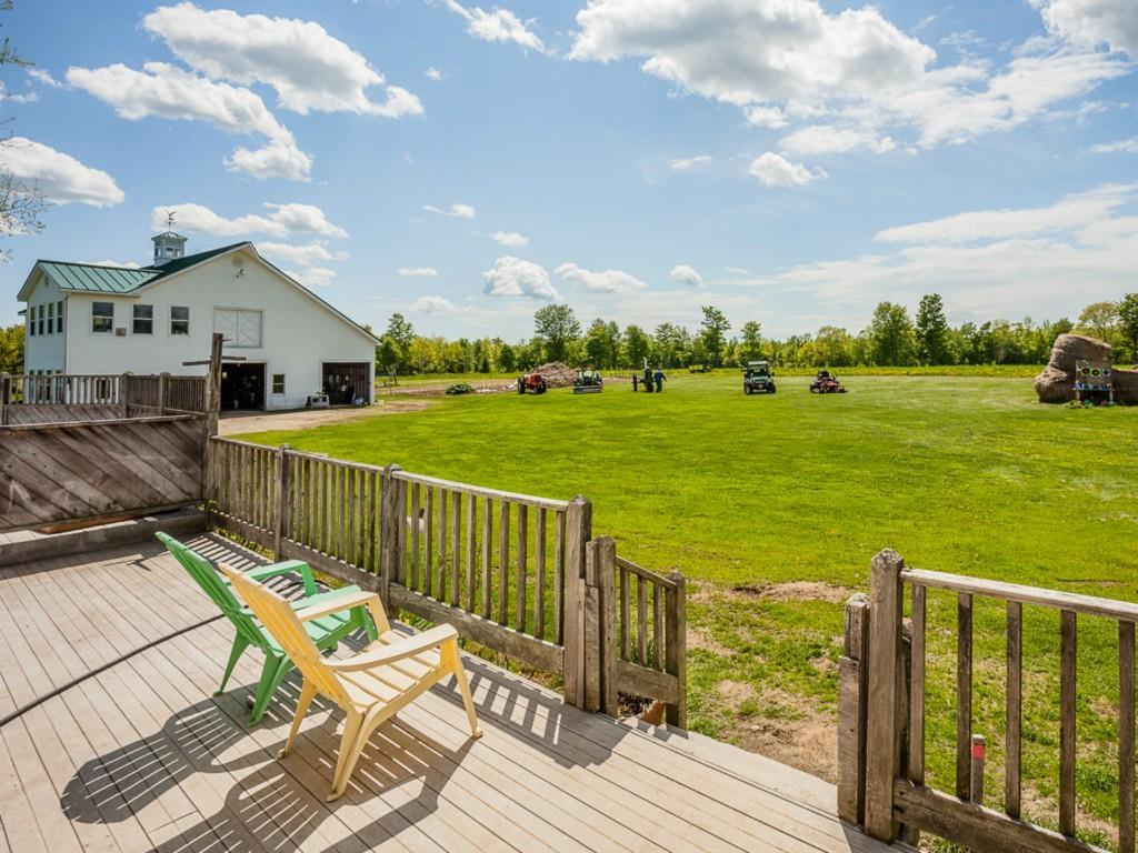 404 Phillips Corner Road Pittsfield, ME 04967 - Photo 5 of 31 Patio/Deck. sunny deck with view of...