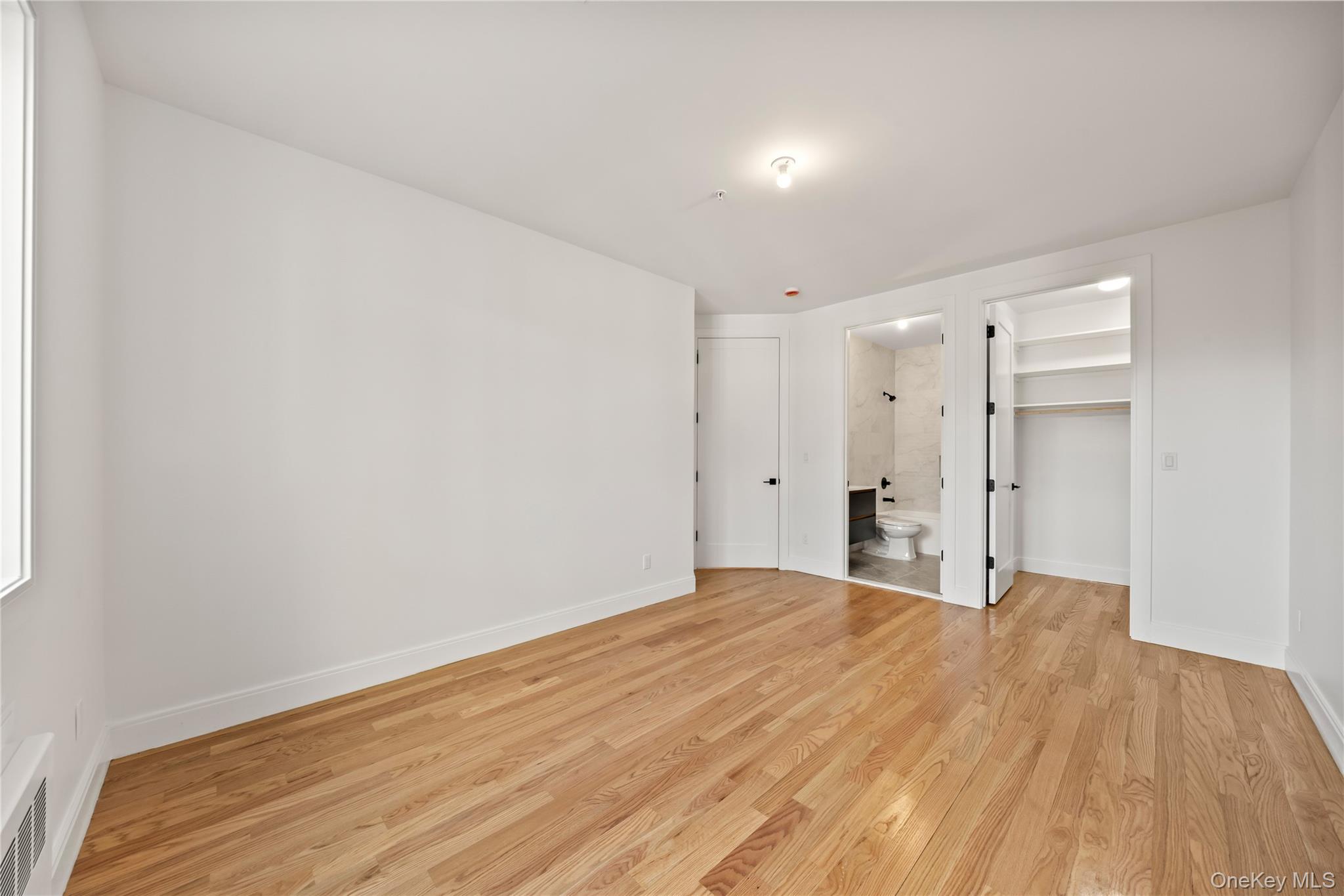 5 Jeffrey Place, Unit 102 Monsey, NY 10952 - Photo 13 of 23 a view of empty room with wooden floor