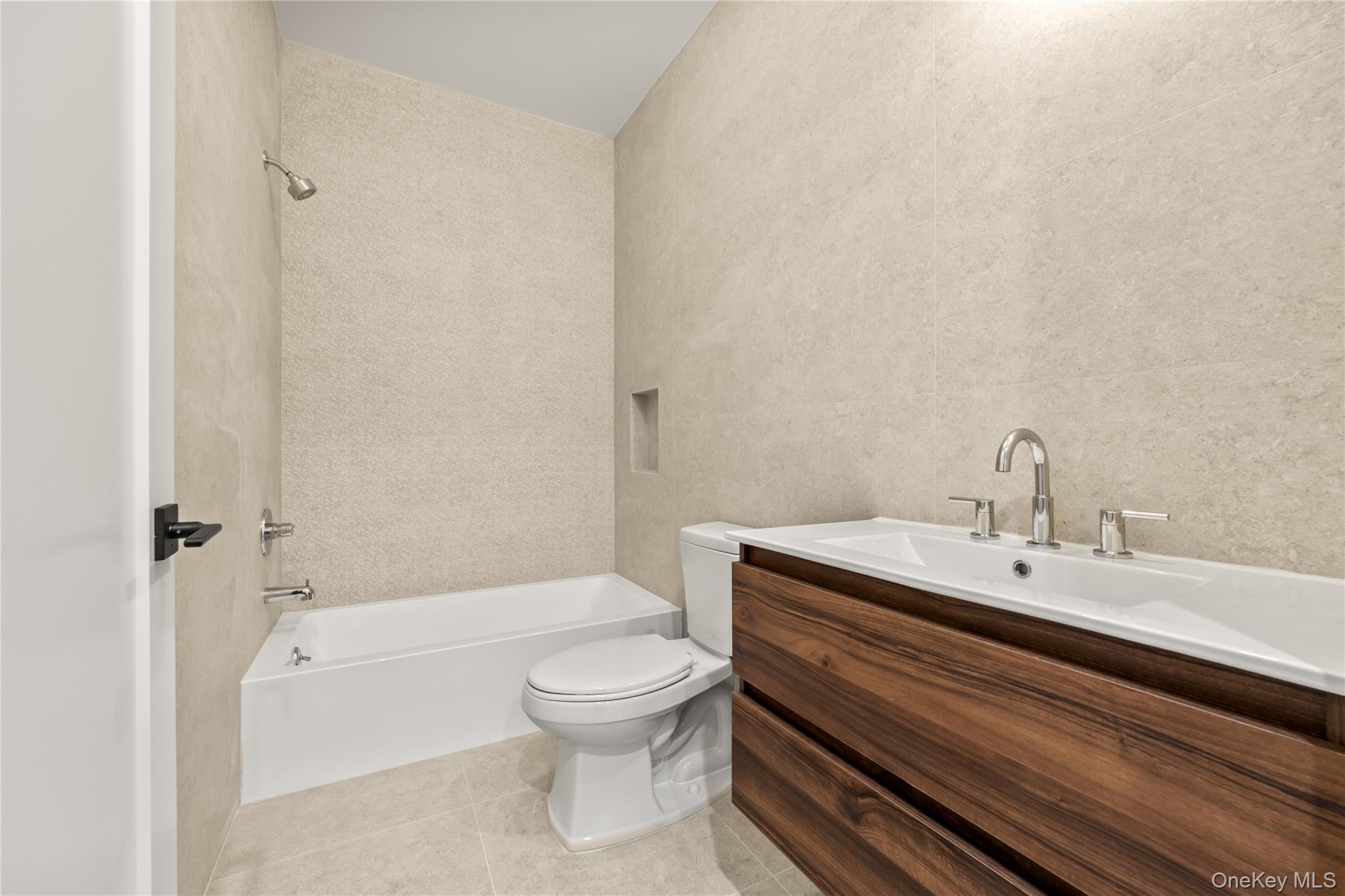 5 Jeffrey Place, Unit 102 Monsey, NY 10952 - Photo 18 of 23 a bathroom with a sink a toilet and shower