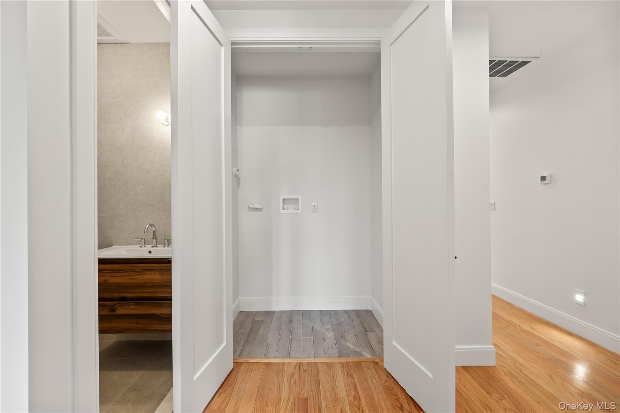 5 Jeffrey Place, Unit 102 Monsey, NY 10952 - Photo 19 of 23 a view of a hallway with wooden floor and closet