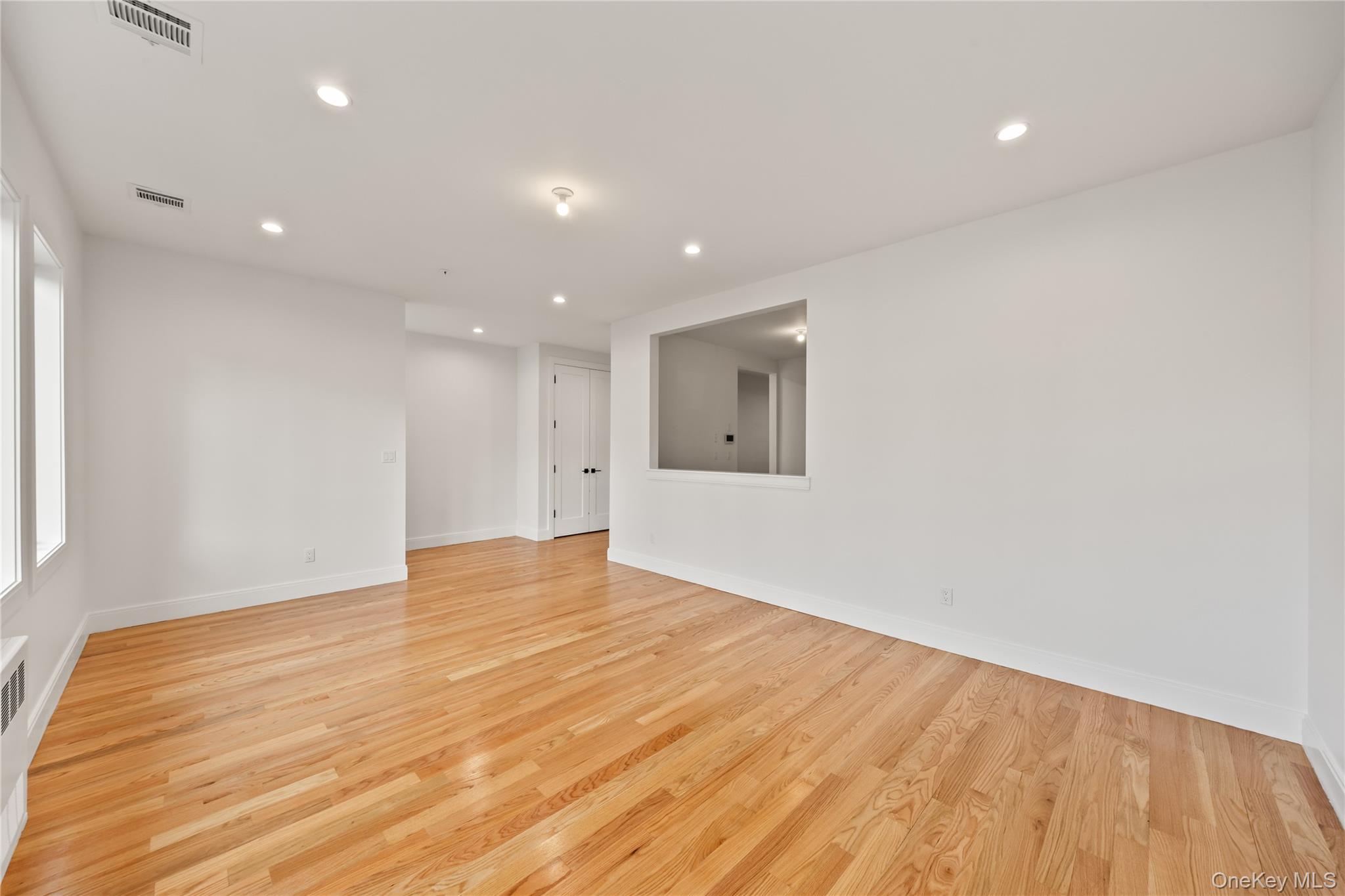 5 Jeffrey Place, Unit 102 Monsey, NY 10952 - Photo 6 of 23 a view of empty room with wooden floor and fan