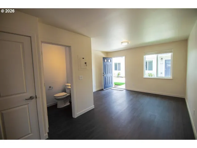 a bathroom with a sink mirror and shower