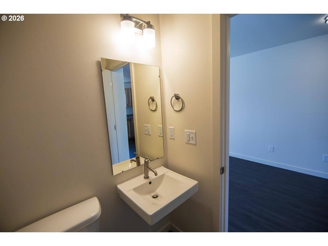 1638 S Street Springfield, OR 97477 - Photo 17 of 31 a bathroom with a sink mirror and shower