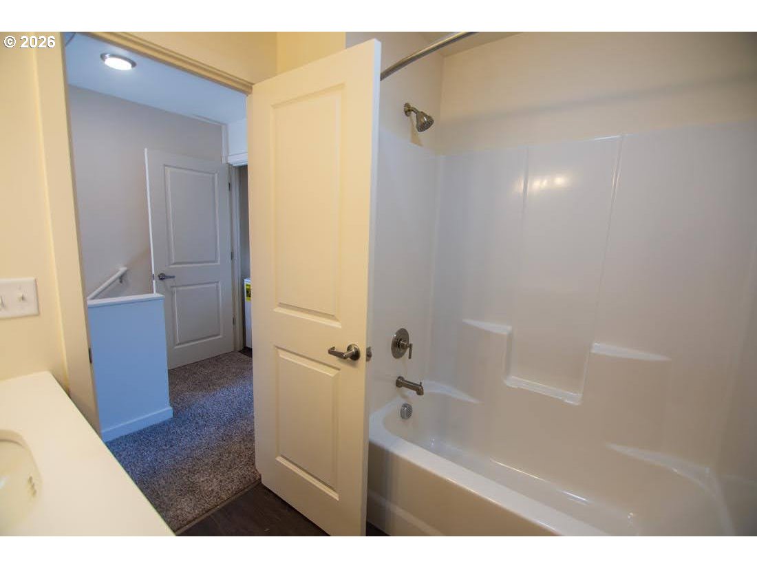 1638 S Street Springfield, OR 97477 - Photo 22 of 31 a bathroom with a bathtub