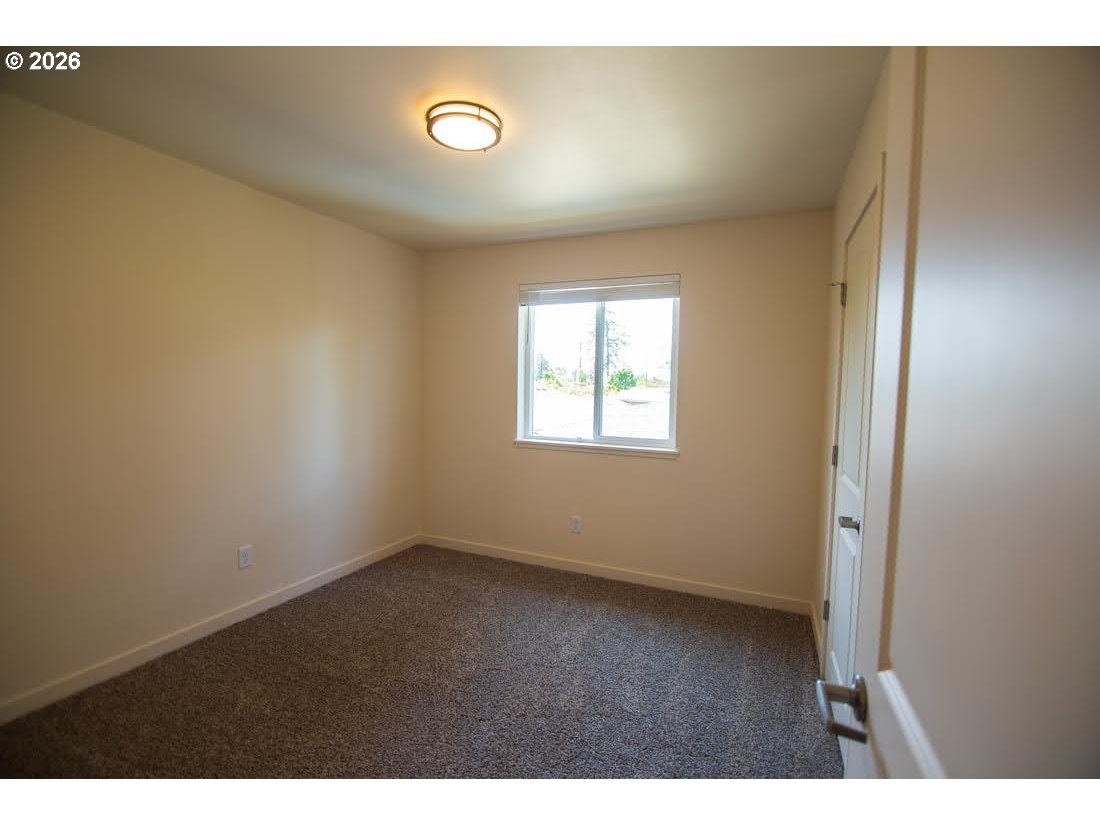 1638 S Street Springfield, OR 97477 - Photo 23 of 31 a view of an empty room with a window