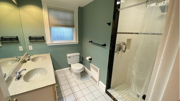 111 University Road Brookline, MA 02445 - Photo 8 of 17 a bathroom with a sink a toilet and shower