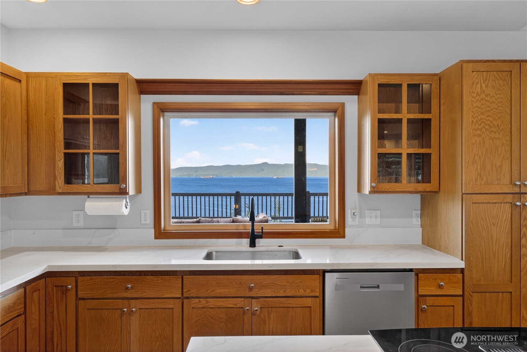 4623 Guemes Island Road Anacortes, WA 98221 - Photo 8 of 40 a kitchen with a sink and cabinets