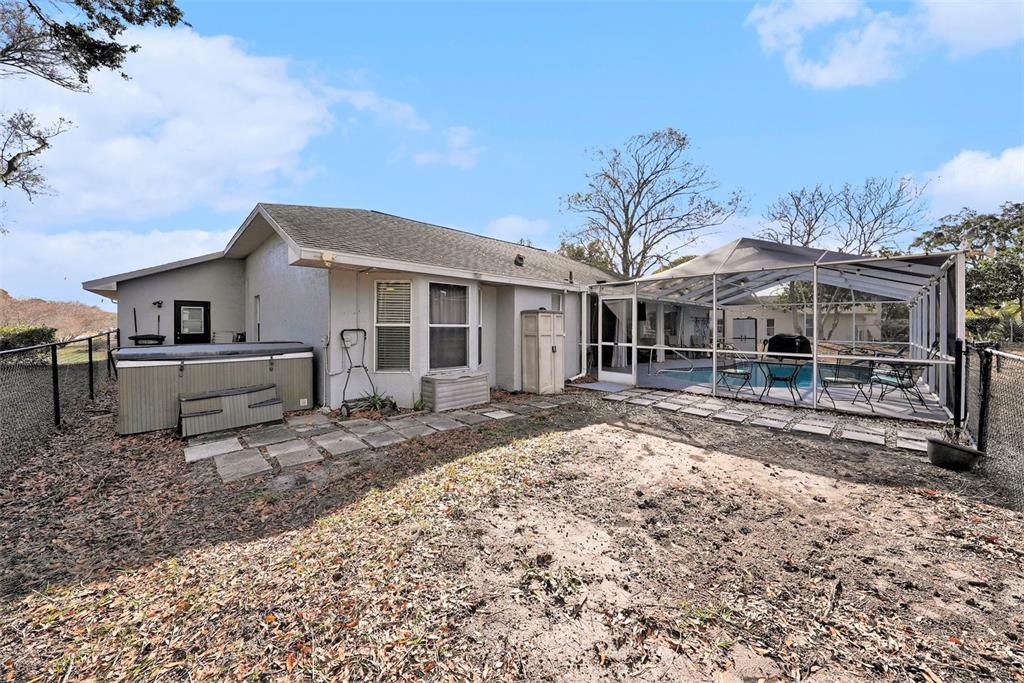 2583 Running Oak Court Spring Hill, FL 34608 - Photo 11 of 13 a front view of a house with a yard covered with snow in front of house