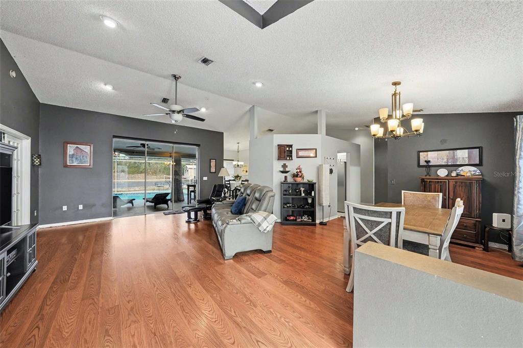 2583 Running Oak Court Spring Hill, FL 34608 - Photo 2 of 13 a view of a livingroom with dining room and wooden floor