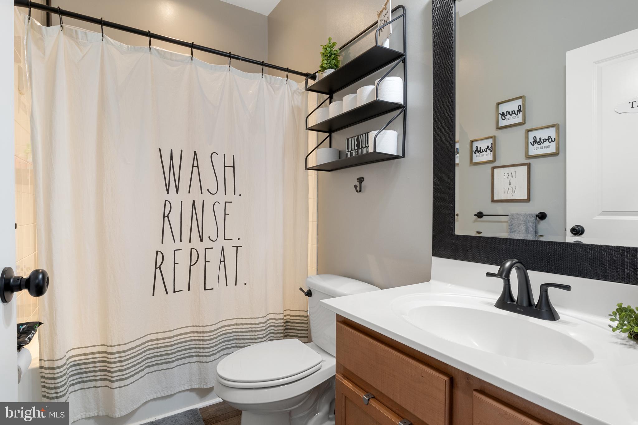 855 Blossom Drive Hanover, PA 17331 - Photo 26 of 53 a bathroom with a sink a toilet and shower