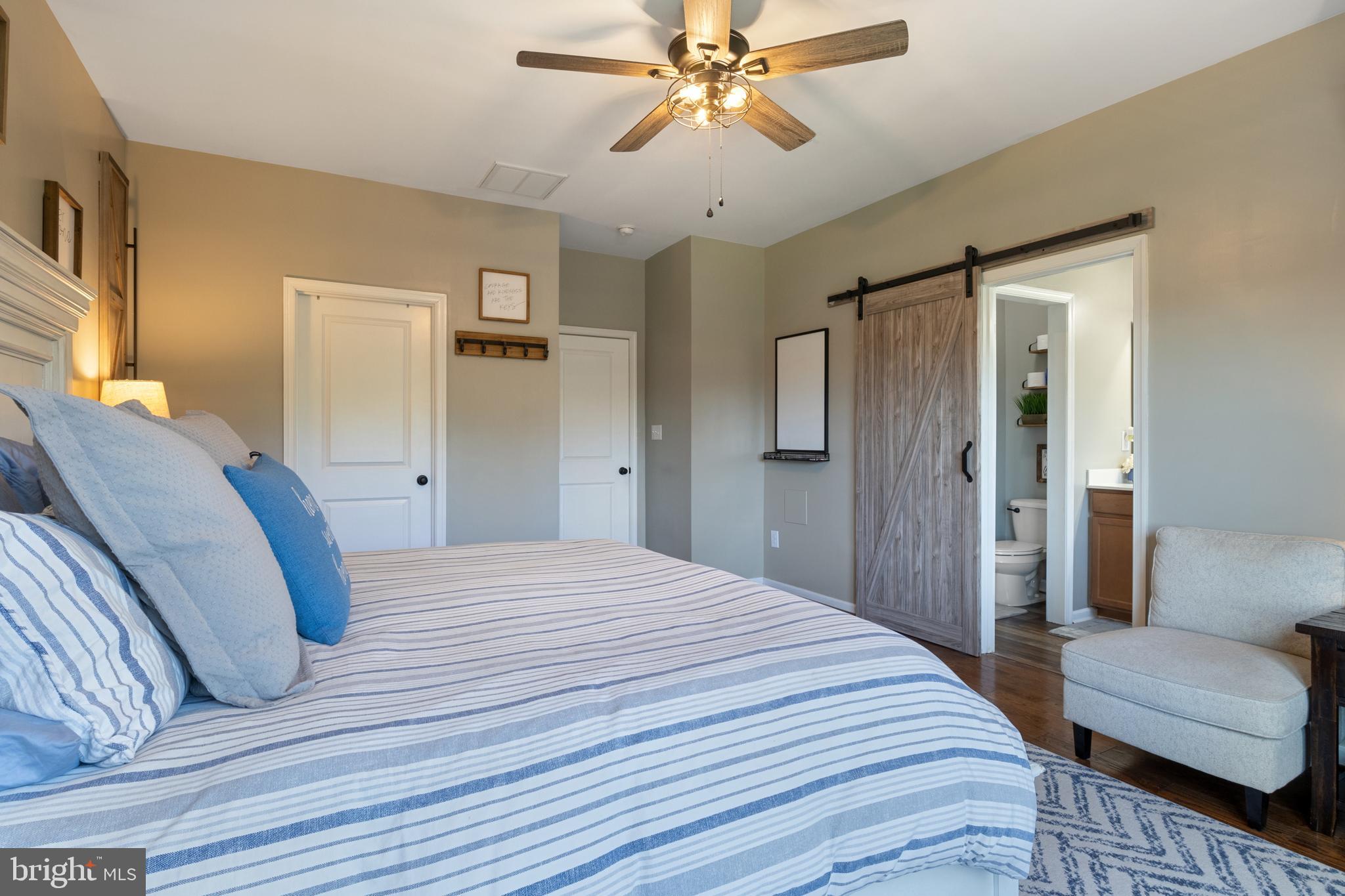 855 Blossom Drive Hanover, PA 17331 - Photo 29 of 53 a bedroom with a bed and a chandelier