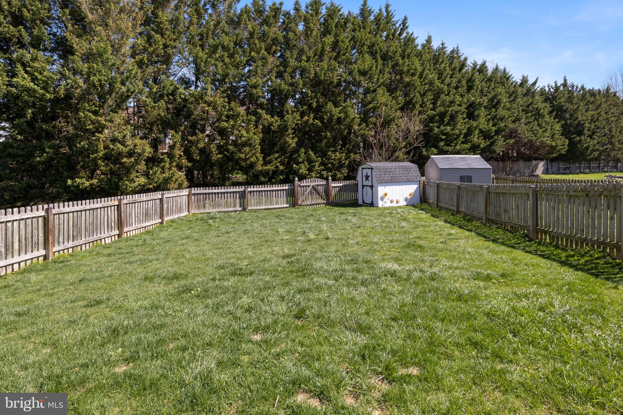 855 Blossom Drive Hanover, PA 17331 - Photo 38 of 53 a view of a backyard with a small house and wooden fence